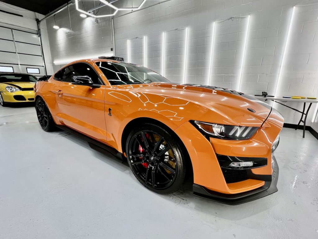 Orange Sports Car from passenger side front view