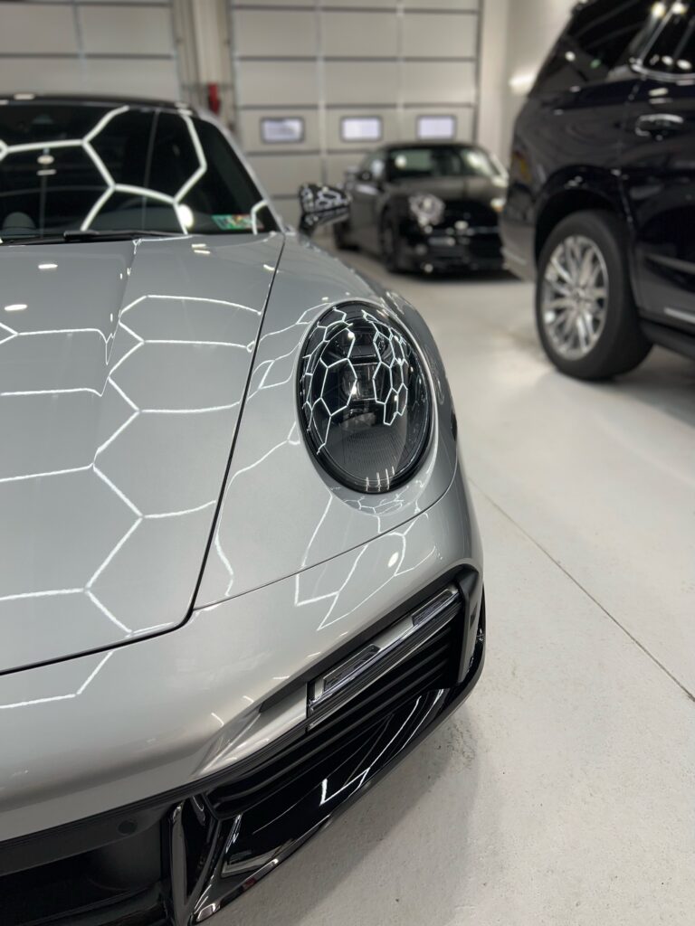 Right front side of grey Porsche